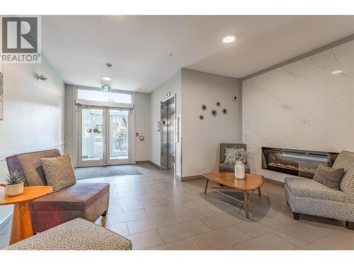 Lobby Area - 722 Valley Road Unit# 200, Kelowna, BC - Indoor Photo Showing Living Room With Fireplace
