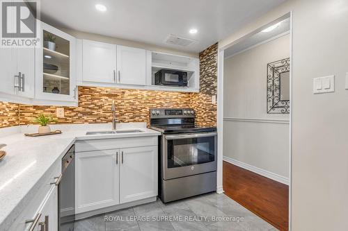 1907 - 3590 Kaneff Crescent, Mississauga, ON - Indoor Photo Showing Kitchen With Double Sink