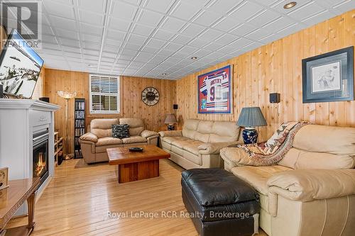 LOWER LEVEL FAMILY ROOM - 48 Island View Drive N, South Bruce Peninsula, ON - Indoor Photo Showing Living Room With Fireplace