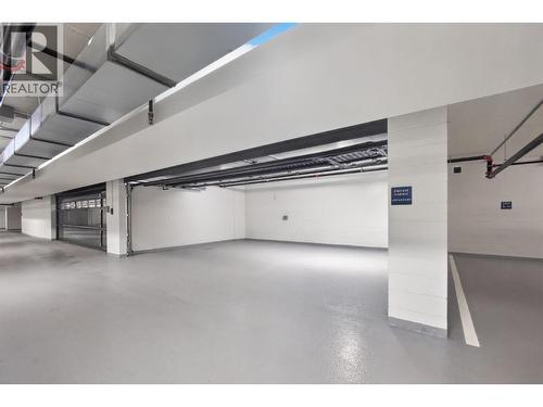 Private triple car garage located on P2 near the elevators - 3800 Capozzi Road Unit# Ph2, Kelowna, BC - Indoor Photo Showing Garage