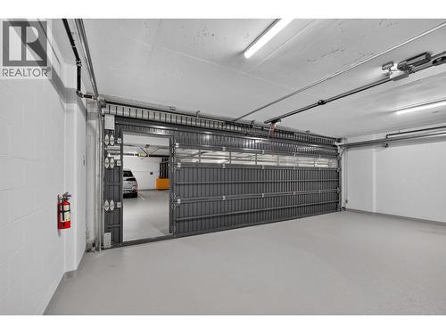 Man-door for additional access convenience - 3800 Capozzi Road Unit# Ph2, Kelowna, BC - Indoor Photo Showing Garage