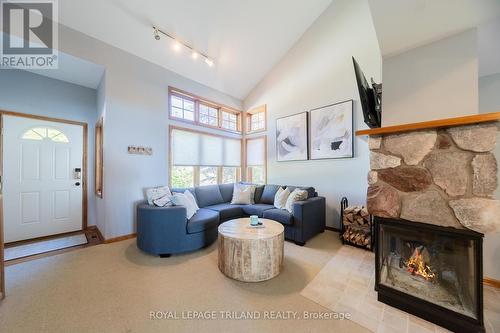 73437 Sandy Beach Road, Bluewater (Hay), ON - Indoor Photo Showing Living Room With Fireplace