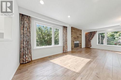 15 Alamosa Drive, Toronto, ON - Indoor Photo Showing Living Room With Fireplace