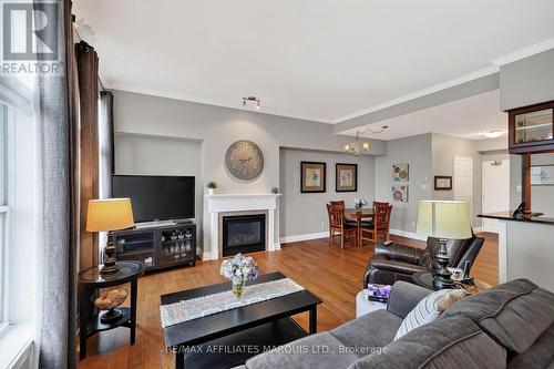 402 - 341 Water Street W, Cornwall, ON - Indoor Photo Showing Living Room With Fireplace