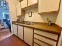320 Northgate Unit# 209, Tumbler Ridge, BC  - Indoor Photo Showing Kitchen With Double Sink 