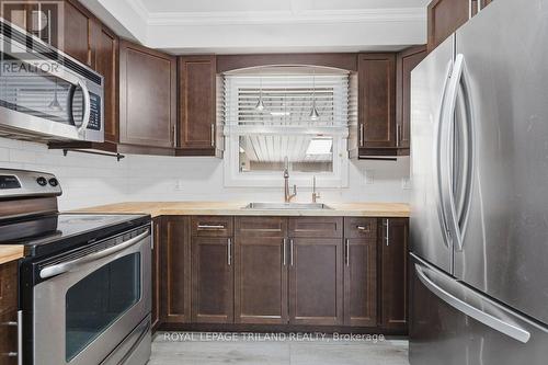 Over the range microwave - 308 Reynolds Road, London South (South B), ON - Indoor Photo Showing Kitchen With Stainless Steel Kitchen