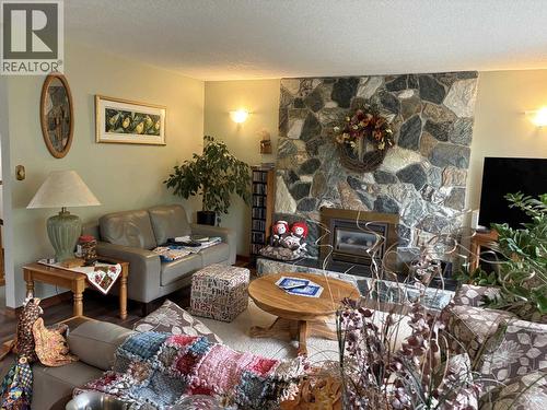 404 N Birch Avenue, 100 Mile House, BC - Indoor Photo Showing Living Room With Fireplace