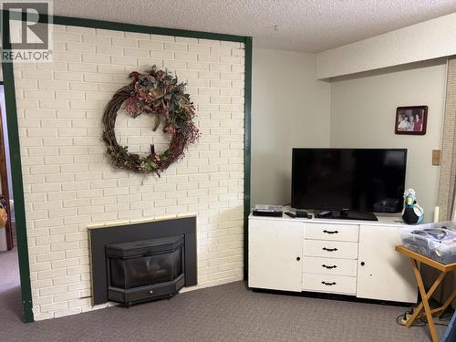 404 N Birch Avenue, 100 Mile House, BC - Indoor Photo Showing Living Room With Fireplace