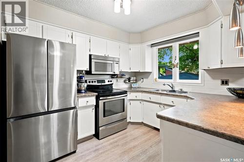 111 Minot Drive, Regina, SK - Indoor Photo Showing Kitchen With Double Sink