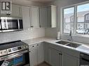 35 4850 Harbour Landing Drive, Regina, SK  - Indoor Photo Showing Kitchen With Double Sink 