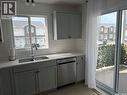 35 4850 Harbour Landing Drive, Regina, SK  - Indoor Photo Showing Kitchen With Double Sink 