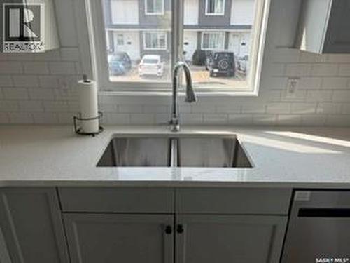 35 4850 Harbour Landing Drive, Regina, SK - Indoor Photo Showing Kitchen With Double Sink
