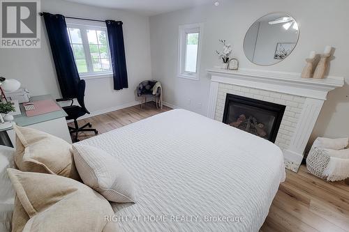 62 Hazel Street, St. Catharines, ON - Indoor Photo Showing Bedroom With Fireplace