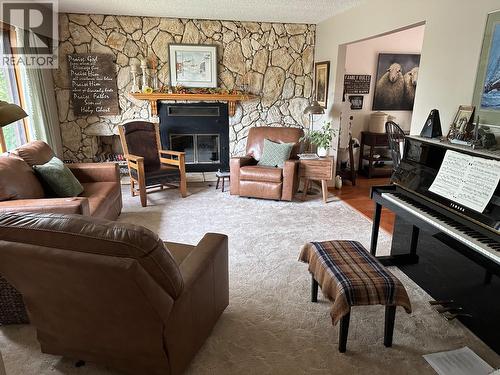5128 44 Place Ne, Chetwynd, BC - Indoor Photo Showing Living Room With Fireplace