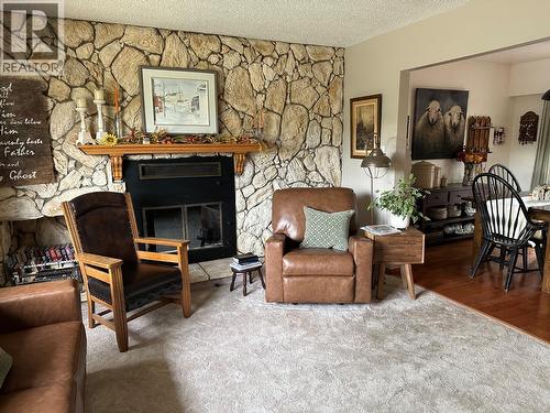 5128 44 Place Ne, Chetwynd, BC - Indoor Photo Showing Living Room With Fireplace