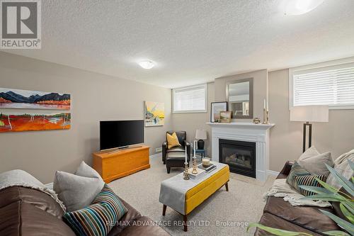 39 - 620 Thistlewood Drive, London North (North C), ON - Indoor Photo Showing Other Room With Fireplace