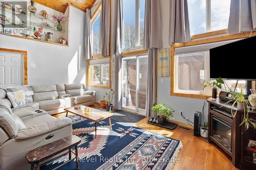 2242 Highway 124, Whitestone (Dunchurch), ON - Indoor Photo Showing Living Room With Fireplace