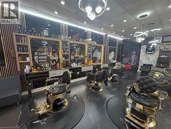 Commercial interior with sleek dark flooring and multiple service stations - 