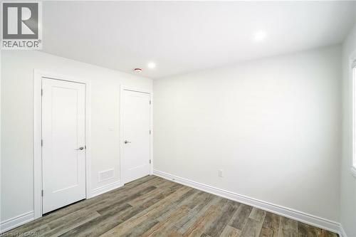 Interior room featuring wood-finish flooring, recessed lighting, and crisp white walls - 8 Marlborough Road, Guelph, ON - Indoor Photo Showing Other Room