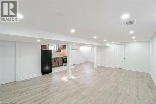 Open-concept living area featuring light wood-finish flooring and recessed lighting - 8 Marlborough Road, Guelph, ON - Indoor