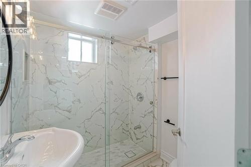 Contemporary bathroom featuring a walk-in shower with a sliding glass door - 8 Marlborough Road, Guelph, ON - Indoor Photo Showing Bathroom
