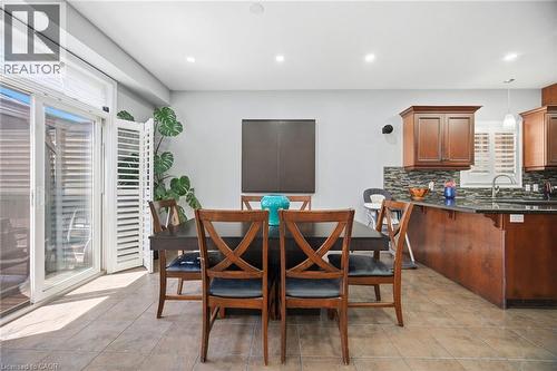 Open concept dining area with tile flooring and sliding glass doors - 79 Garinger Crescent, Hamilton, ON - Indoor Photo Showing Dining Room