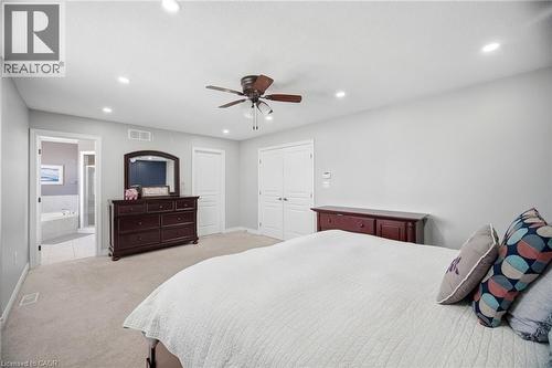 Spacious room featuring neutral carpeting, recessed lighting, and a ceiling fan - 79 Garinger Crescent, Hamilton, ON - Indoor Photo Showing Bedroom