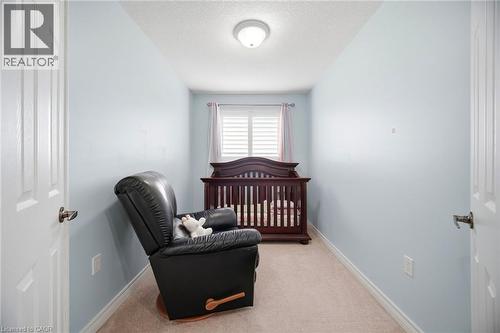 Room featuring light blue walls, white trim, and neutral carpet flooring - 79 Garinger Crescent, Hamilton, ON - Indoor