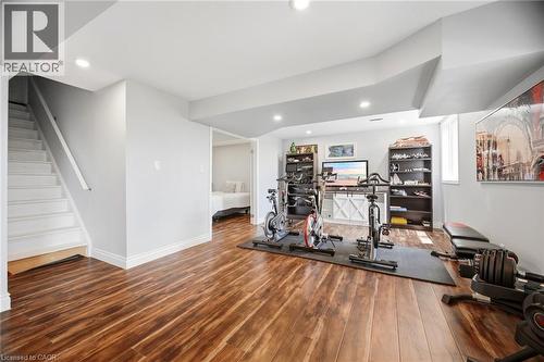 Spacious lower level featuring wood-finish flooring and recessed lighting - 79 Garinger Crescent, Hamilton, ON - Indoor Photo Showing Gym Room