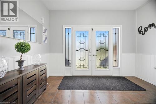 Double entry doors with decorative glass panels and sidelights - 79 Garinger Crescent, Hamilton, ON - Indoor Photo Showing Other Room