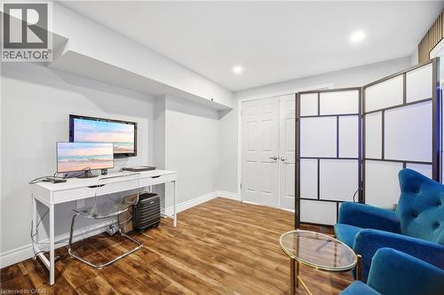 Interior room featuring wood-finish flooring and light gray walls - 79 Garinger Crescent, Hamilton, ON - Indoor Photo Showing Other Room