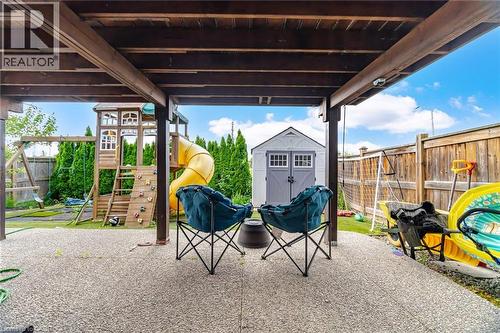 Covered patio area with exposed aggregate concrete flooring - 79 Garinger Crescent, Hamilton, ON - Outdoor With Deck Patio Veranda