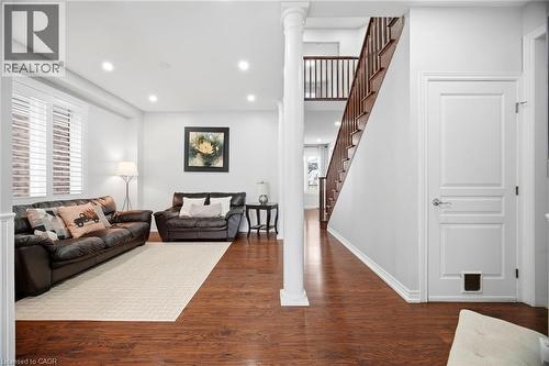 Open-concept living space with rich wood-finish flooring - 79 Garinger Crescent, Hamilton, ON - Indoor