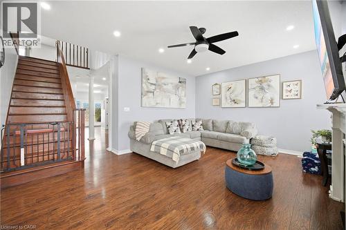 Spacious living area featuring wood-finish flooring, a contemporary ceiling fan, and recessed lighting - 79 Garinger Crescent, Hamilton, ON - Indoor Photo Showing Living Room