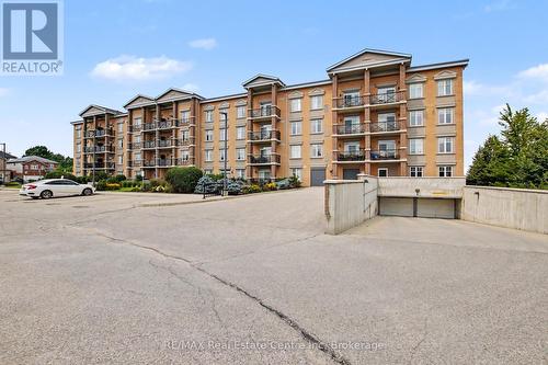 410 - 2 Colonial Drive, Guelph (Pineridge/Westminster Woods), ON - Outdoor With Balcony With Facade