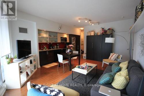 310 - 25 Capreol Court, Toronto, ON - Indoor Photo Showing Living Room