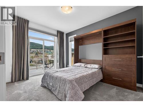 Second Bedroom With Murphy Bed—Perfect For Guests Or A Home Office - 7343 Okanagan Landing Road Unit# 2402, Vernon, BC - Indoor Photo Showing Bedroom