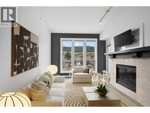 Virtually Staged, Modern Living Space With Cozy Gas Fireplace - 7343 Okanagan Landing Road Unit# 2402, Vernon, BC - Indoor Photo Showing Living Room With Fireplace