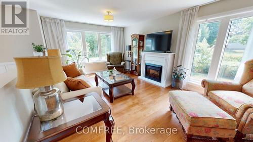 1680 Timmins Avenue, Innisfil (Alcona), ON - Indoor Photo Showing Living Room With Fireplace