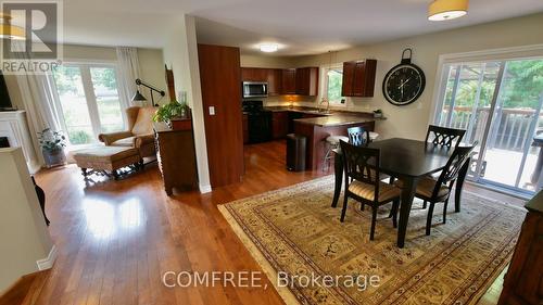 1680 Timmins Avenue, Innisfil (Alcona), ON - Indoor Photo Showing Dining Room With Fireplace