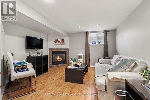 Lower Level Gas Fireplace - 329 Pintail Terrace, Ottawa, ON - Indoor Photo Showing Living Room With Fireplace