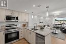 Virtually Staged - 206 - 3998 Victoria Avenue, Lincoln (Lincoln-Jordan/Vineland), ON  - Indoor Photo Showing Kitchen With Upgraded Kitchen 