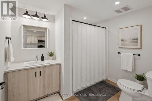 Virtually Staged - 206 - 3998 Victoria Avenue, Lincoln (Lincoln-Jordan/Vineland), ON - Indoor Photo Showing Bathroom