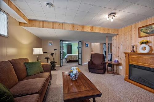 42 Oak Bay, Stonewall, MB - Indoor Photo Showing Living Room With Fireplace