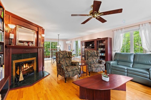 Salon - 150 Rue Hector, Rosemère, QC - Indoor Photo Showing Living Room With Fireplace