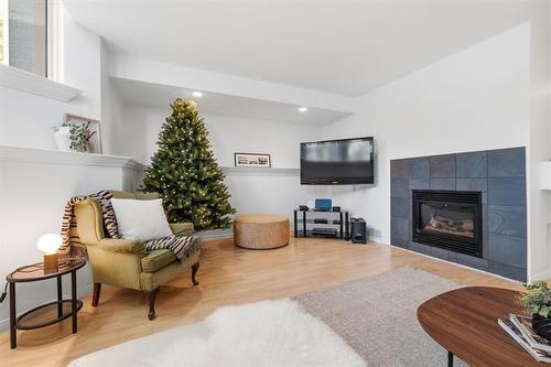 1324 Wellington Cr, Winnipeg, MB - Indoor Photo Showing Living Room With Fireplace