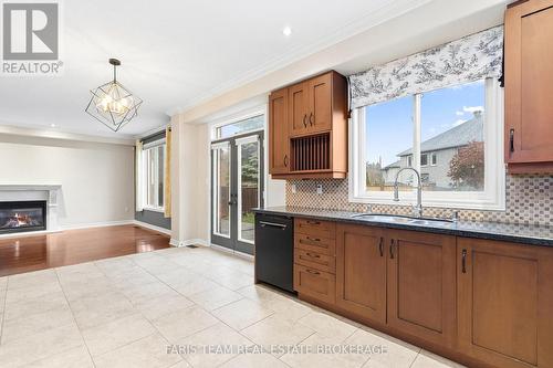3 Prince William Way, Barrie, ON - Indoor Photo Showing Kitchen With Fireplace With Double Sink