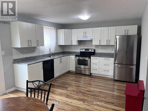 AI Enhanced - 3 - 486 Springbank Avenue N, Woodstock, ON - Indoor Photo Showing Kitchen With Double Sink