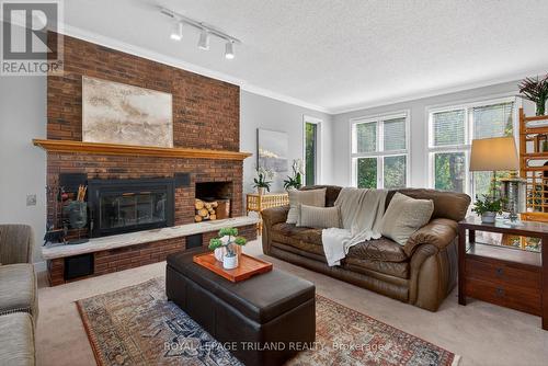 83 Blackburn Crescent, Middlesex Centre (Kilworth), ON - Indoor Photo Showing Living Room With Fireplace