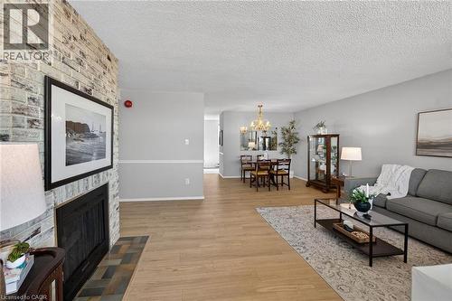 700 Dynes Road Unit# 904, Burlington, ON - Indoor Photo Showing Living Room With Fireplace